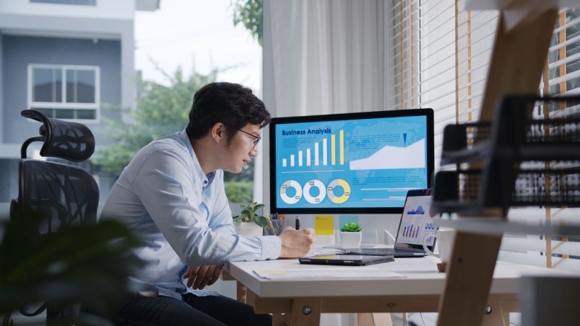 A person at a computer or with data/analytics visuals, representing data science work.