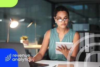 A woman is working on a company's cost report